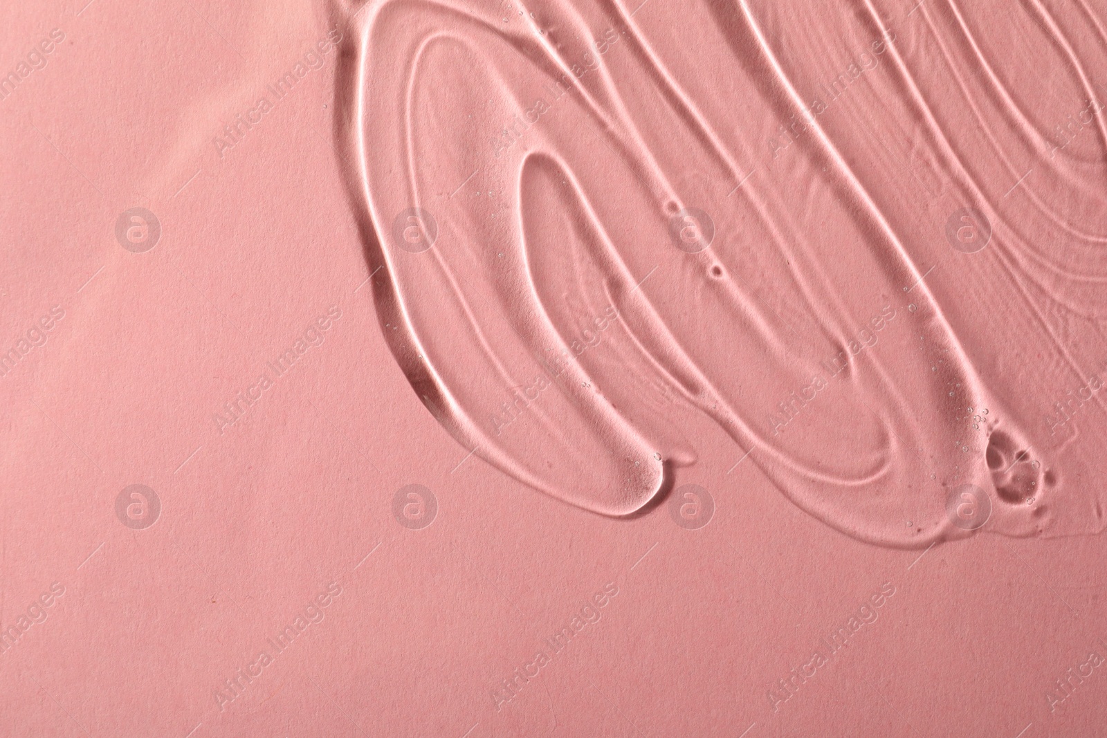 Photo of Cosmetic gel on pink background, top view. Space for text