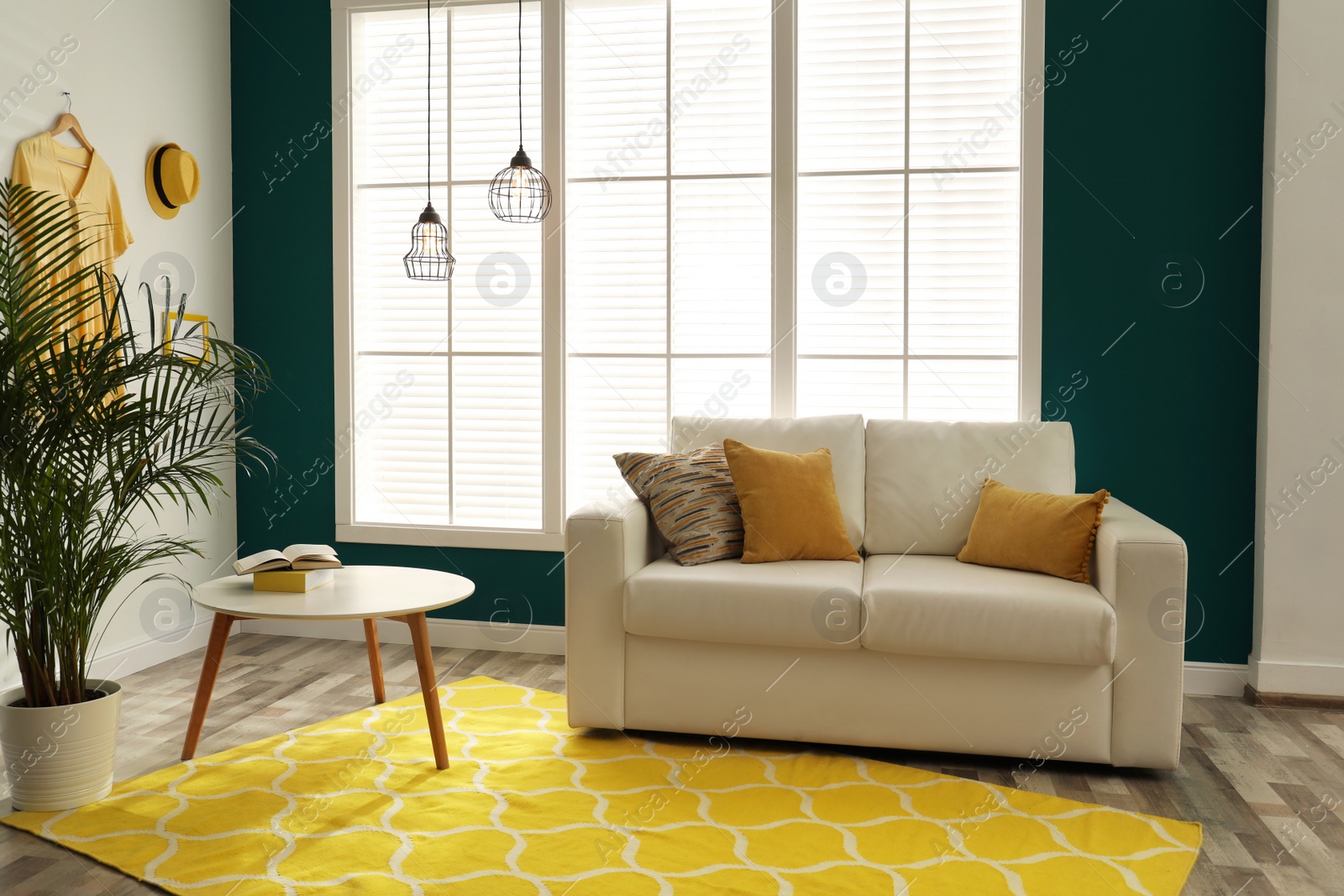 Photo of Modern comfortable sofa in stylish home interior