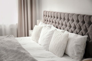 Photo of Pillows on bed in hotel room