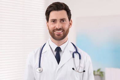 Photo of Portrait of medical consultant with stethoscope in clinic