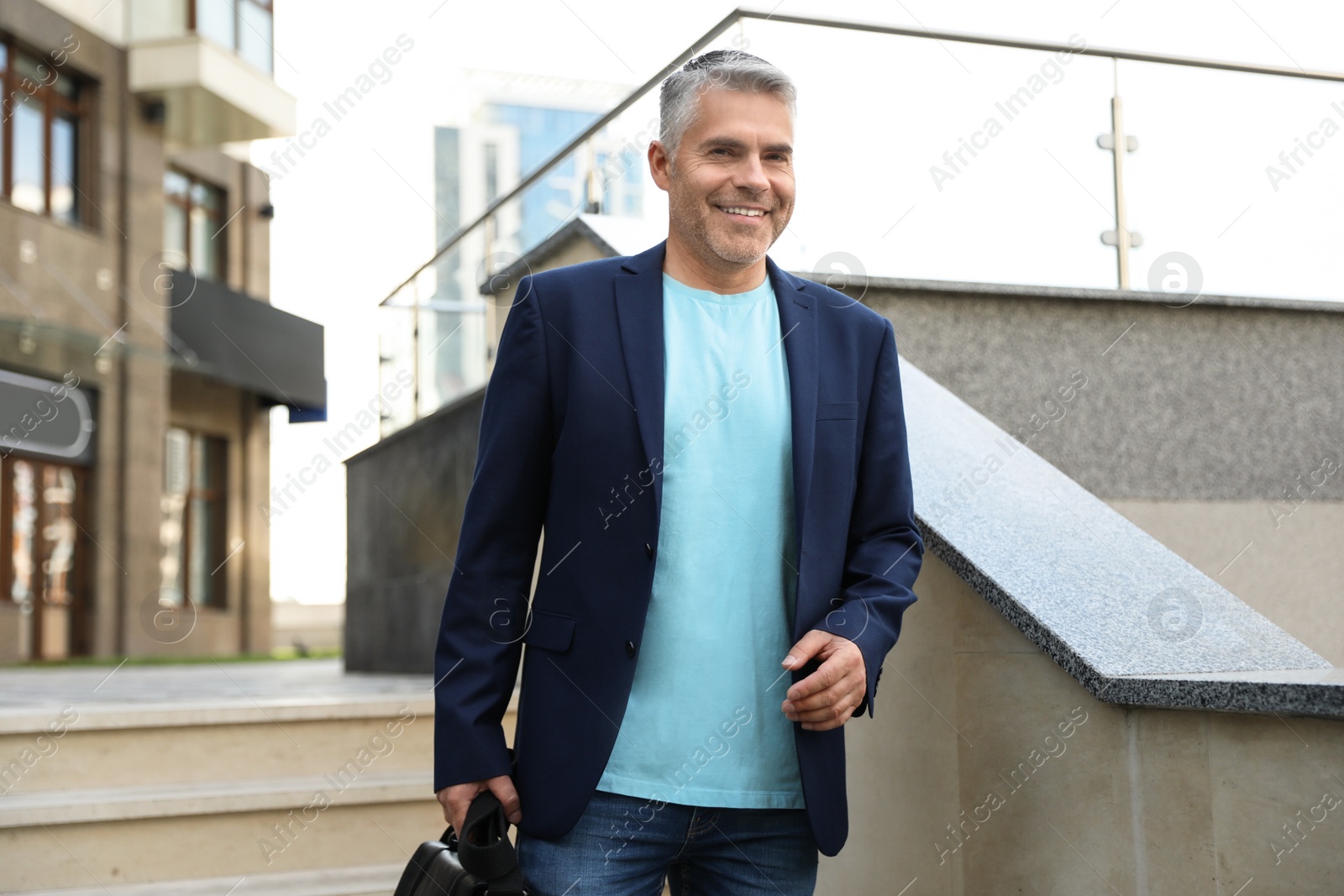 Photo of Portrait of handsome mature man in city center