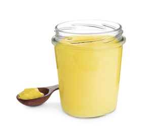 Glass jar and spoon of Ghee butter isolated on white