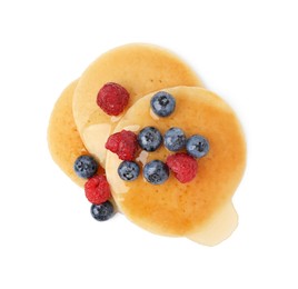 Photo of Tasty pancakes with berries and honey isolated on white, top view