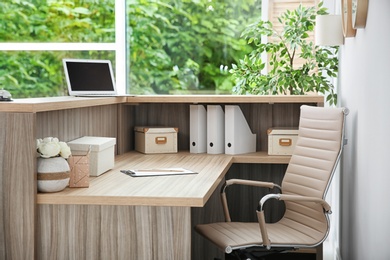 Photo of Receptionist desk in hotel. Workplace interior