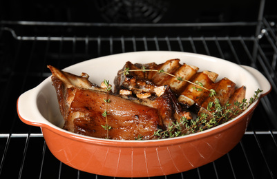 Photo of Delicious roasted ribs with thyme in oven