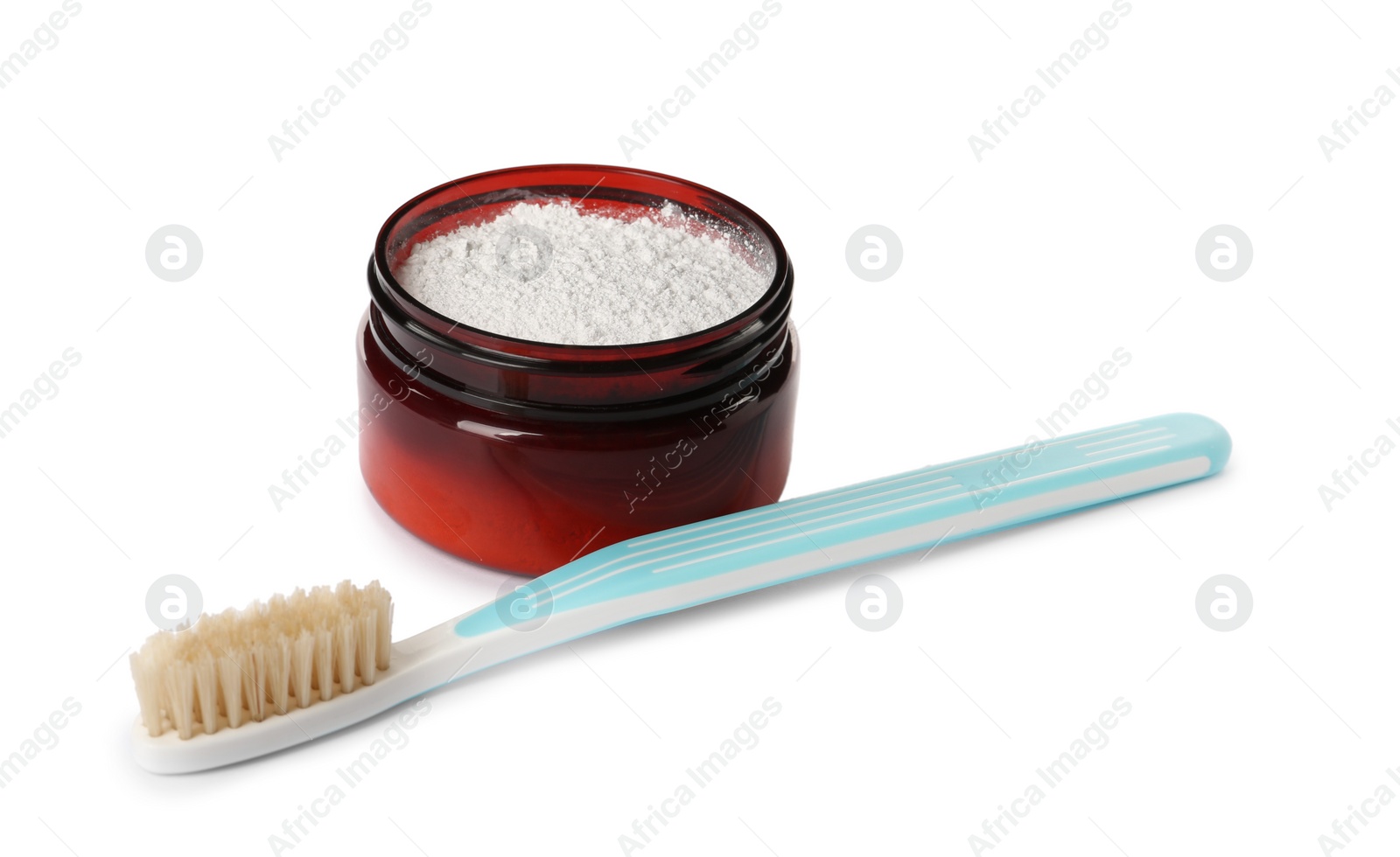 Photo of Jar of tooth powder and brush on white background