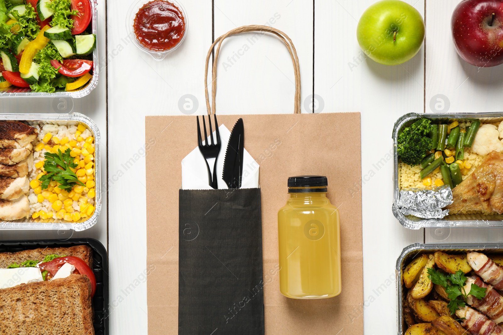 Photo of Lunchboxes on white wooden table, flat lay. Healthy food delivery