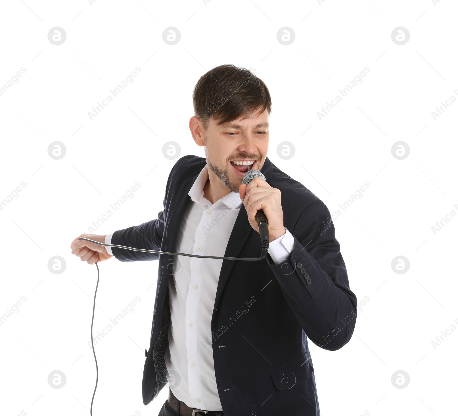 Photo of Handsome man in suit singing with microphone on white background