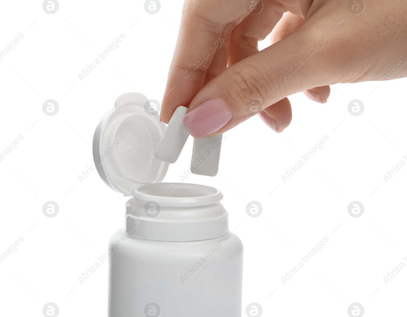 Photo of Woman taking chewing gum pieces from jar on white background, closeup