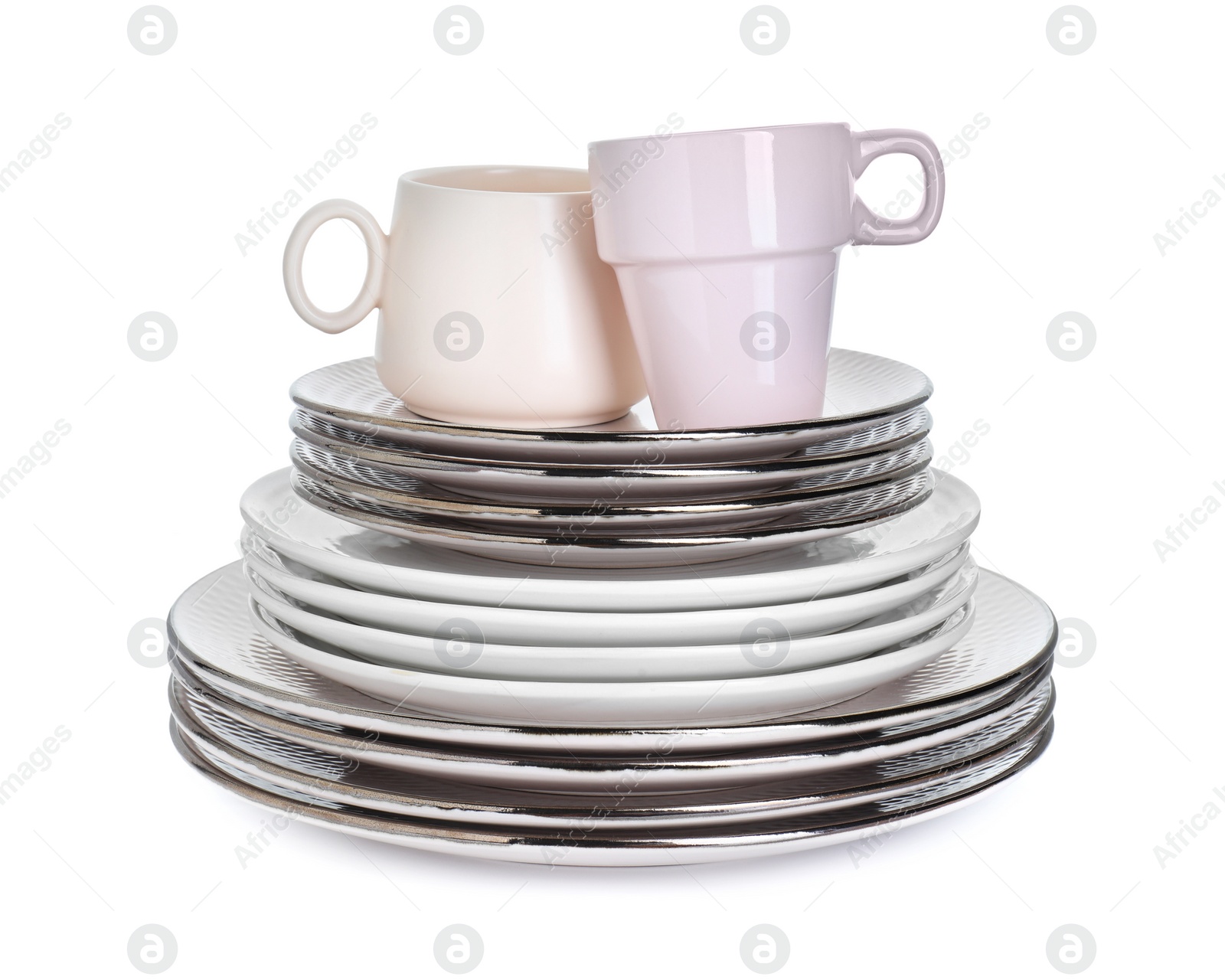 Photo of Beautiful ceramic plates and cups isolated on white