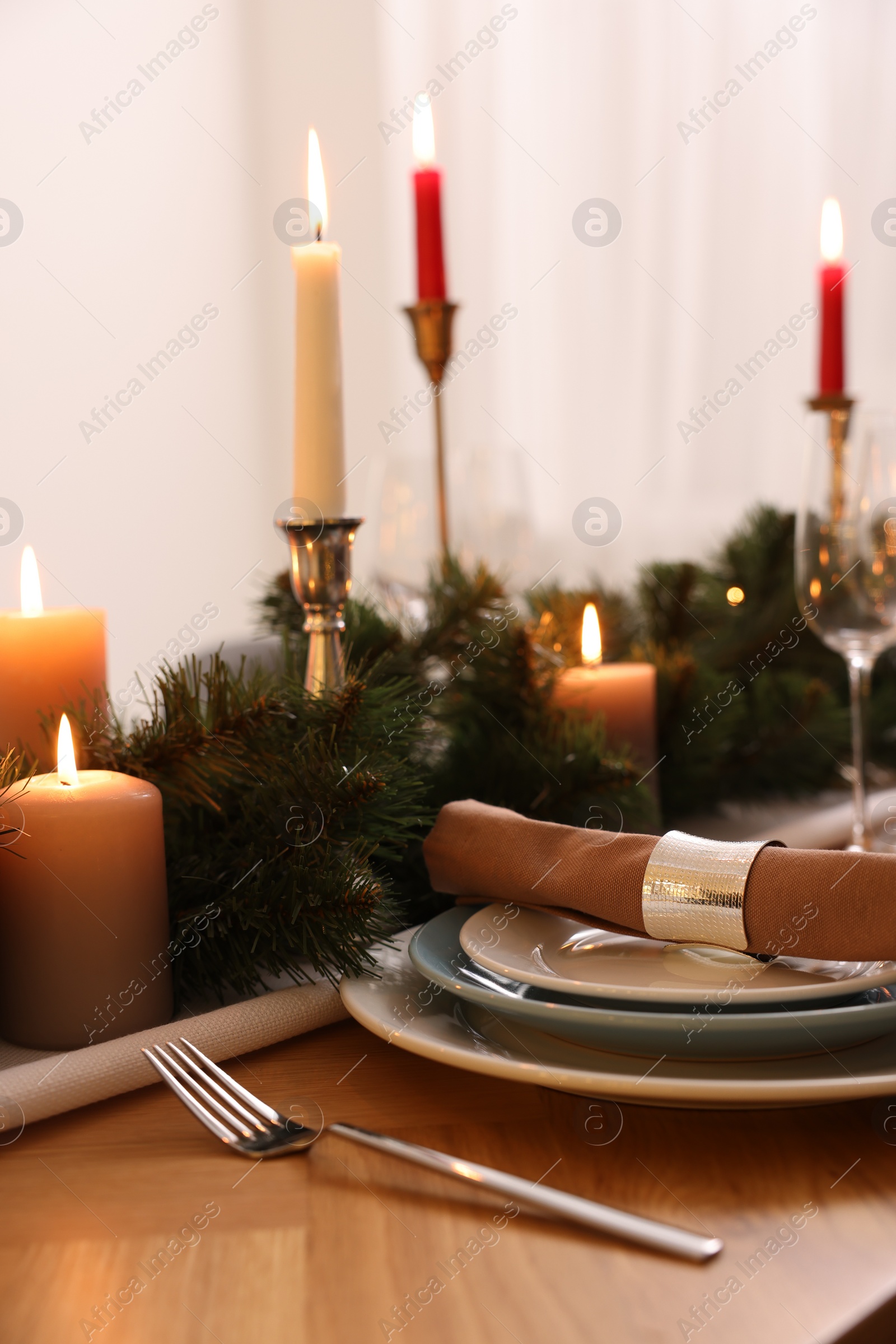 Photo of Luxury place setting with beautiful festive decor for Christmas dinner on wooden table