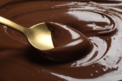 Photo of Eating tasty milk chocolate paste, closeup view