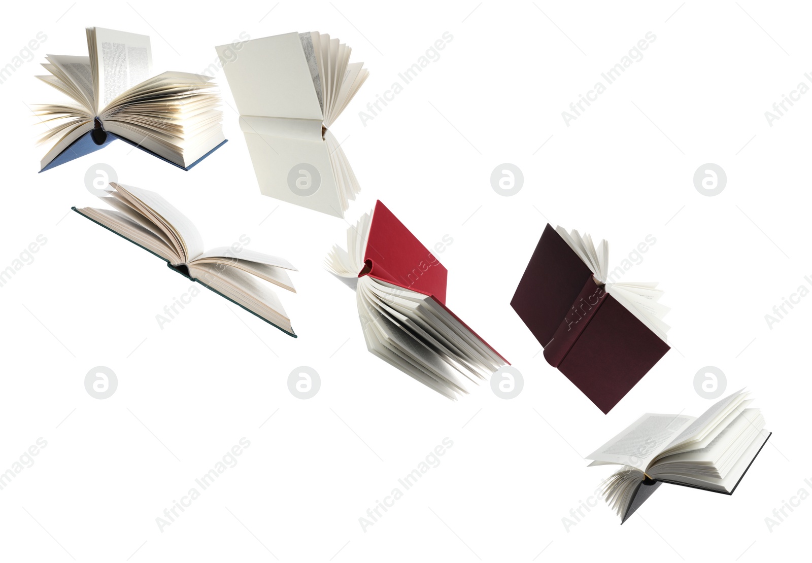 Image of Many hardcover books flying on white background