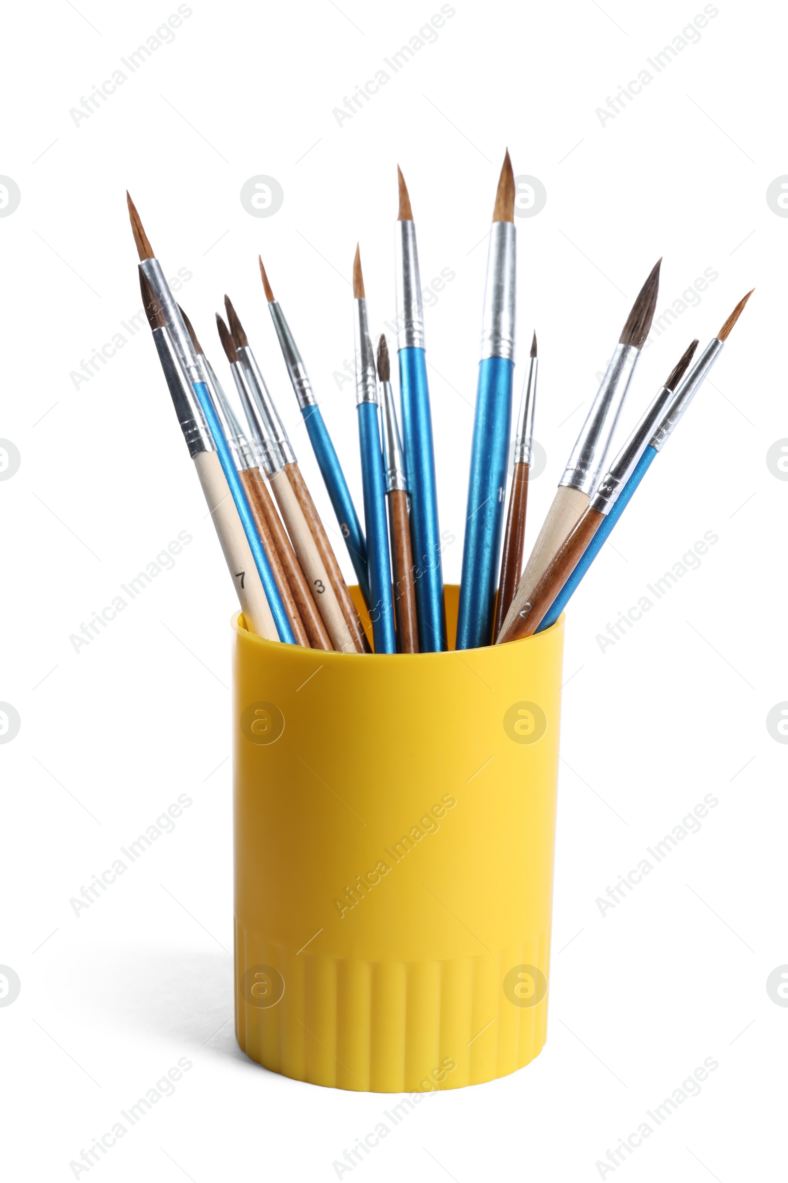 Photo of Holder with different paint brushes on white background