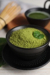 Green matcha powder on white table, closeup