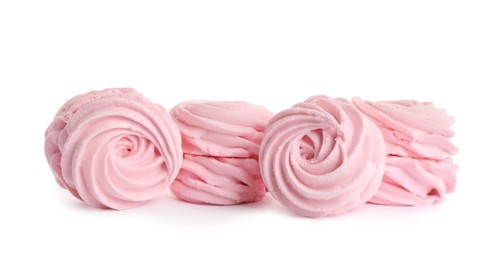 Photo of Many delicious pink zephyrs on white background