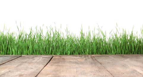 Wooden deck and green grass isolated on white