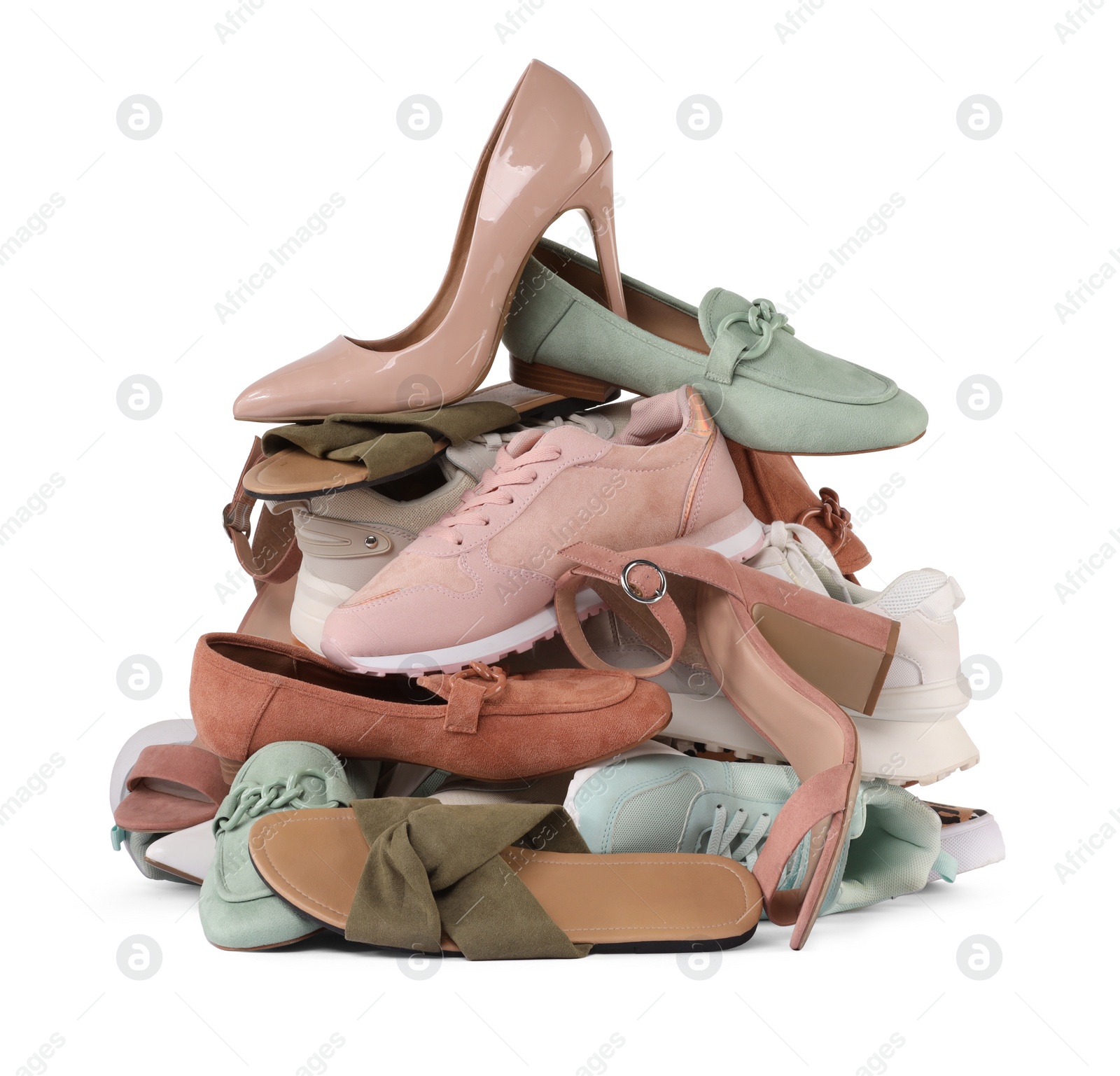 Photo of Pile of different female shoes isolated on white