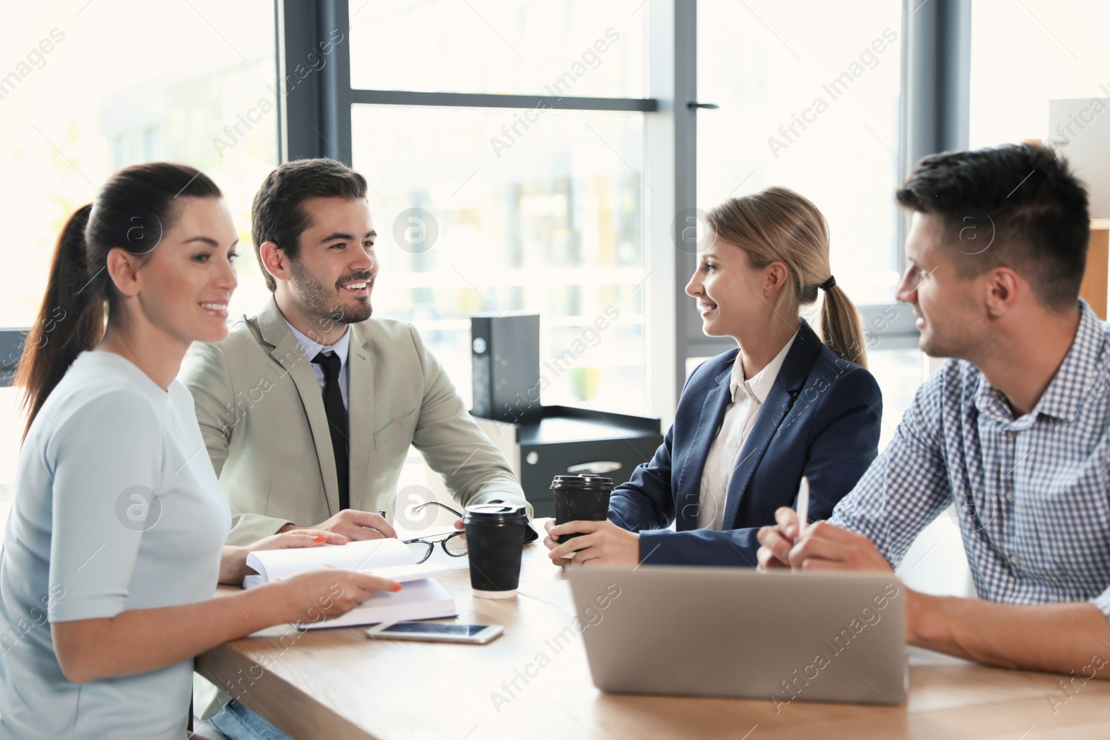 Photo of Office employees having business training at workplace