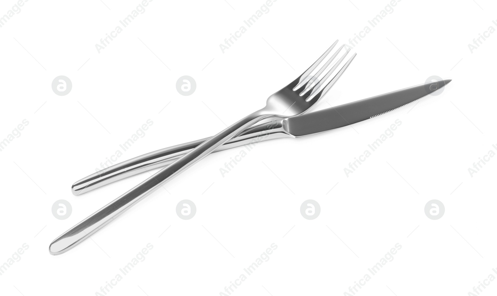 Photo of Fork and knife isolated on white. Stylish shiny cutlery set
