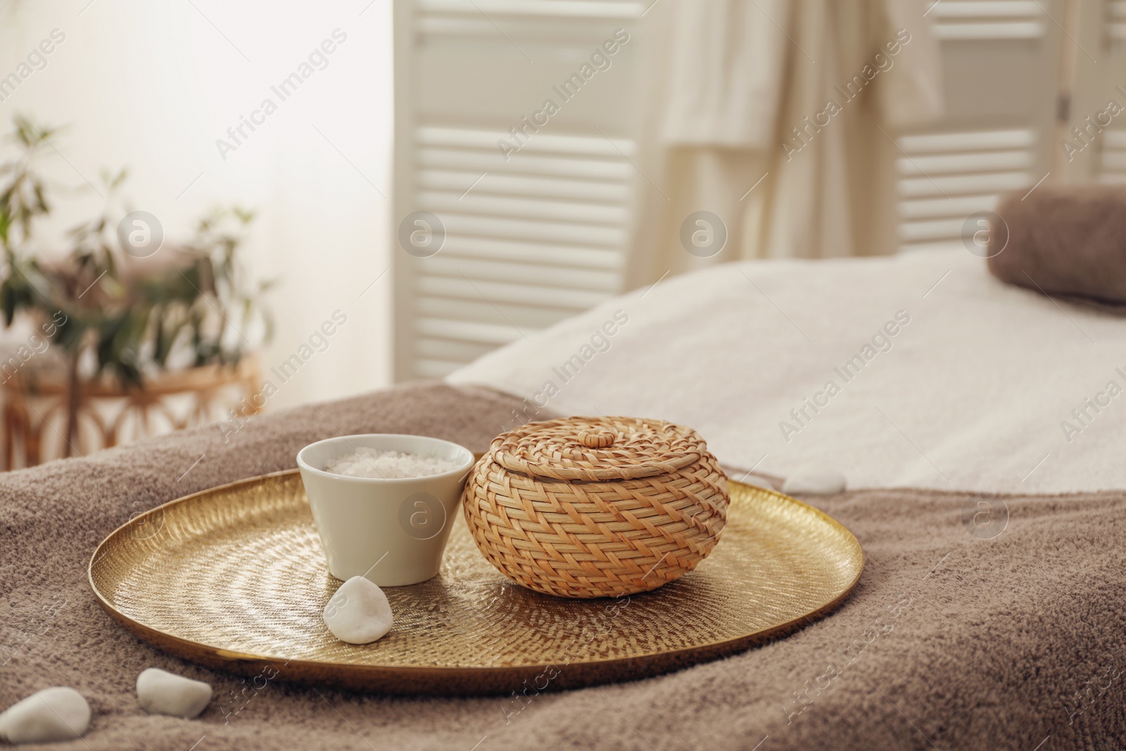 Photo of Beautiful spa composition on massage table in wellness center