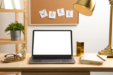 Stylish workplace with different golden accessories indoors. Idea for interior design