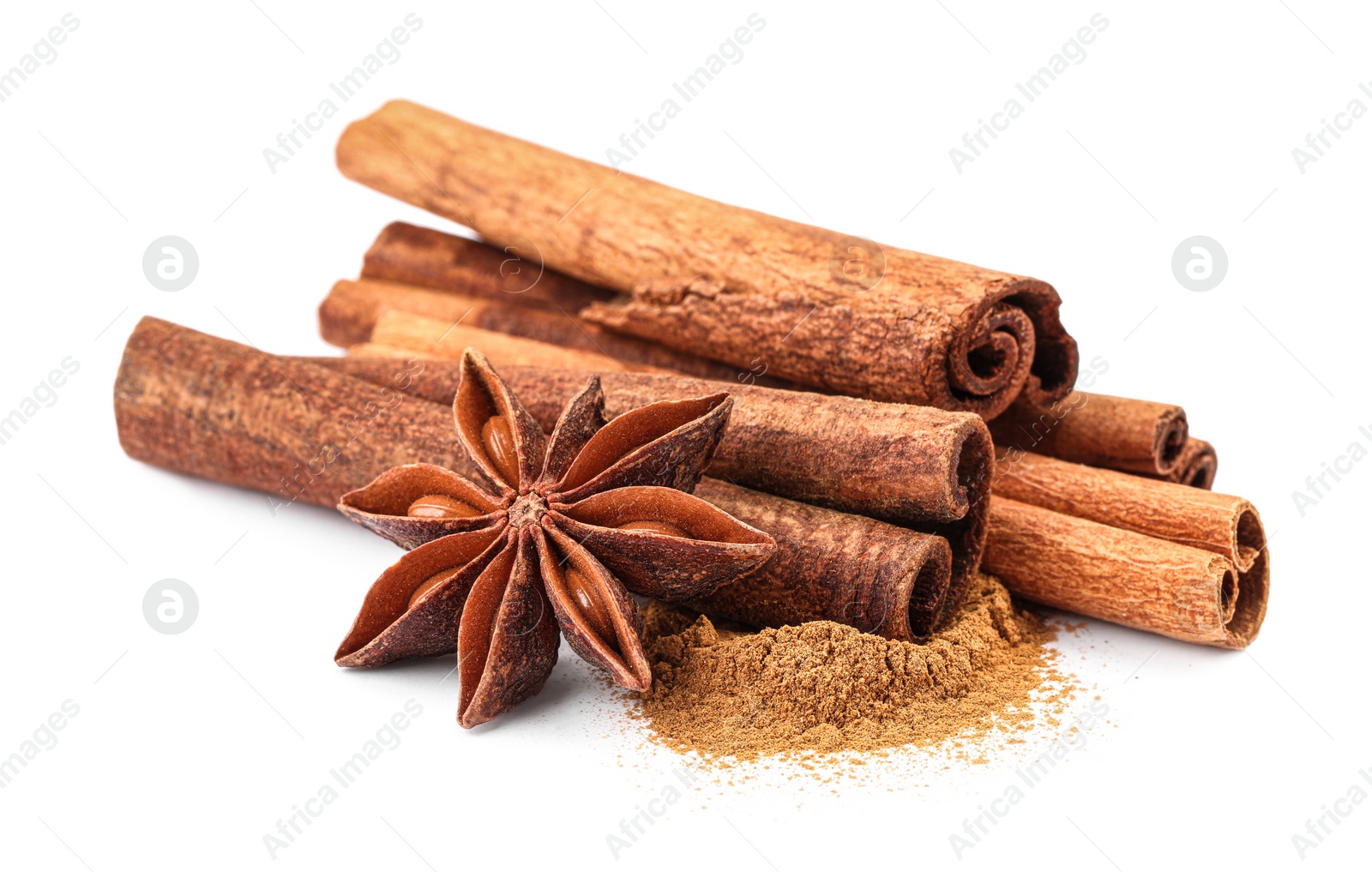 Photo of Dry aromatic cinnamon sticks, powder and anise star isolated on white