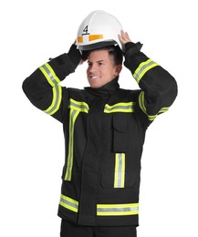 Photo of Portrait of firefighter in uniform wearing helmet on white background