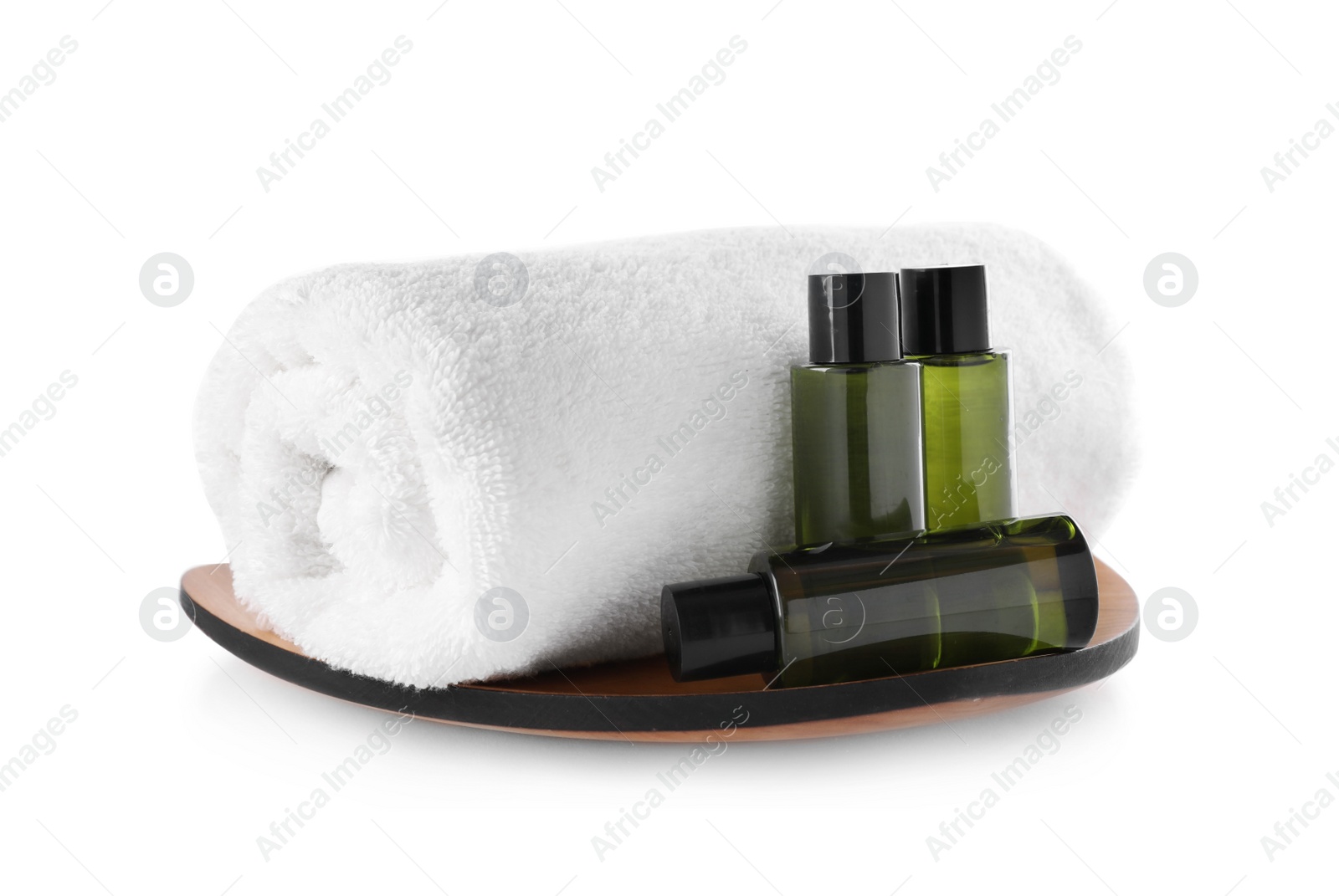 Photo of Composition with mini bottles of cosmetic products and towel on white background