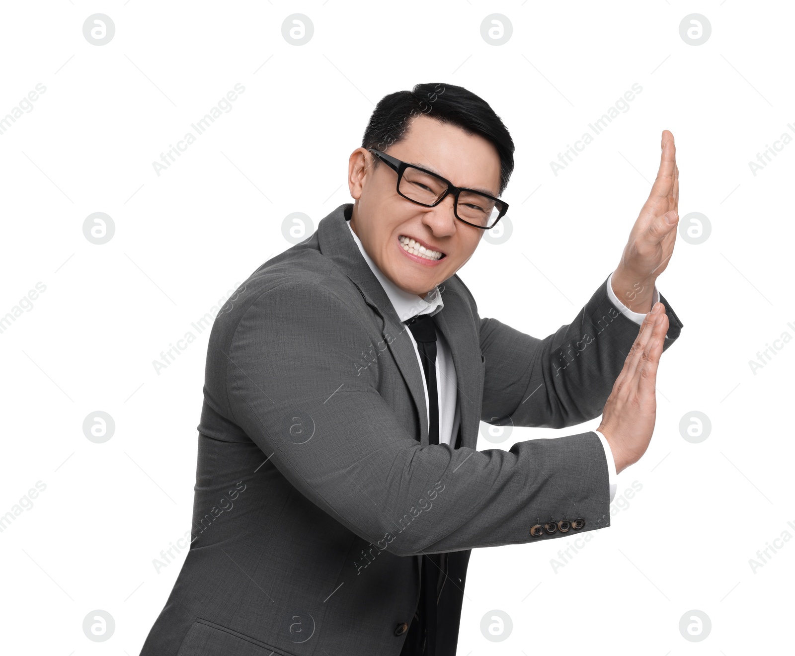 Photo of Scared businessman in suit posing on white background