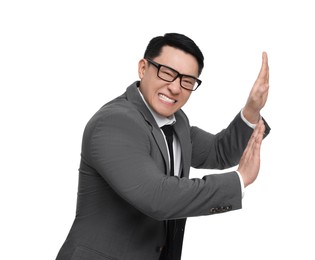 Scared businessman in suit posing on white background