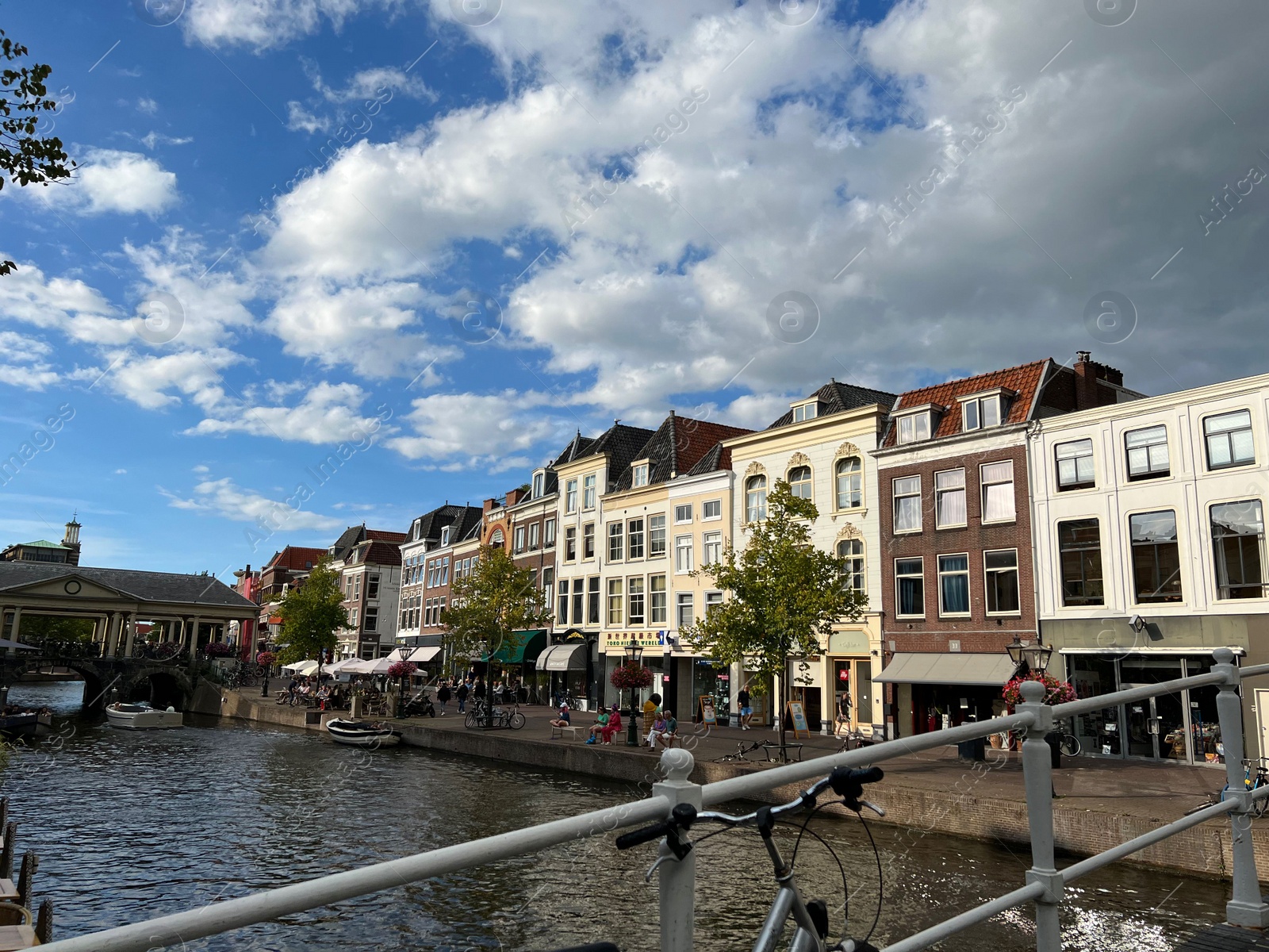 Photo of Beautiful view of buildings near canal in city under cloudy sky