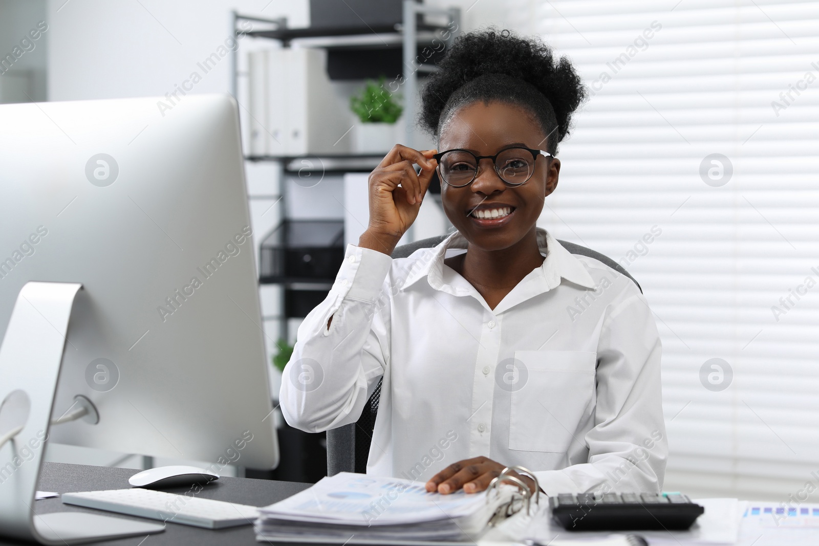 Photo of Professional accountant working at desk in office