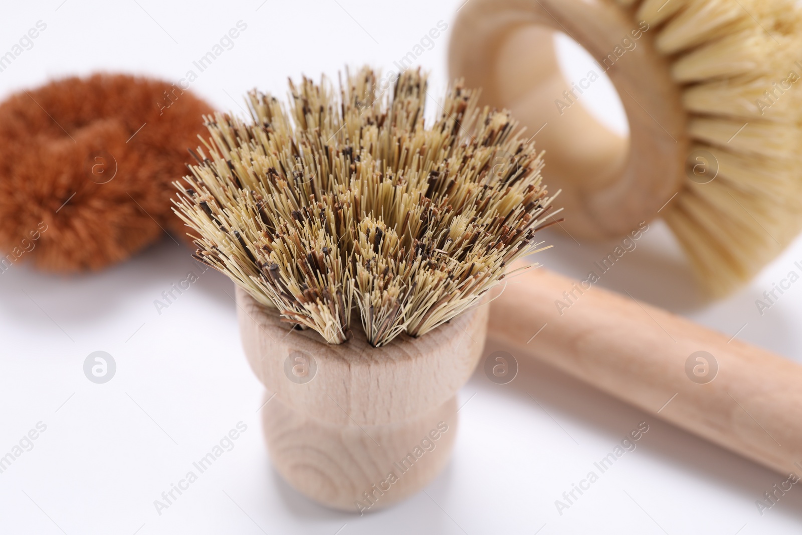 Photo of Cleaning brushes on white background, closeup view