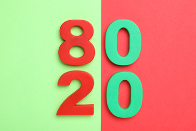 Numbers 80 and 20 on color background, flat lay. Pareto principle concept