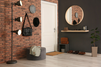 Photo of Modern hallway with stylish furniture. Interior design