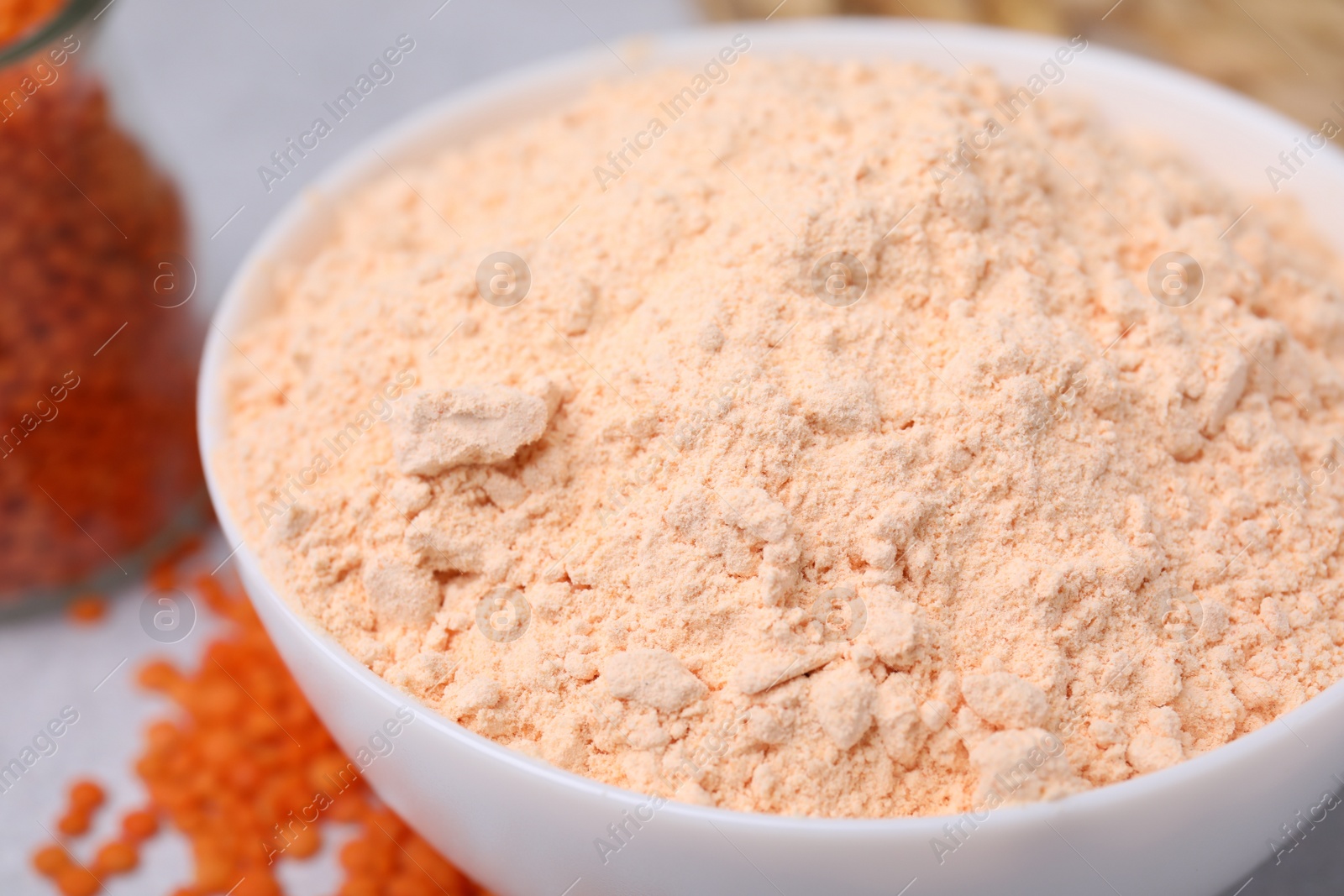 Photo of Organic lentil flour in bowl, closeup view