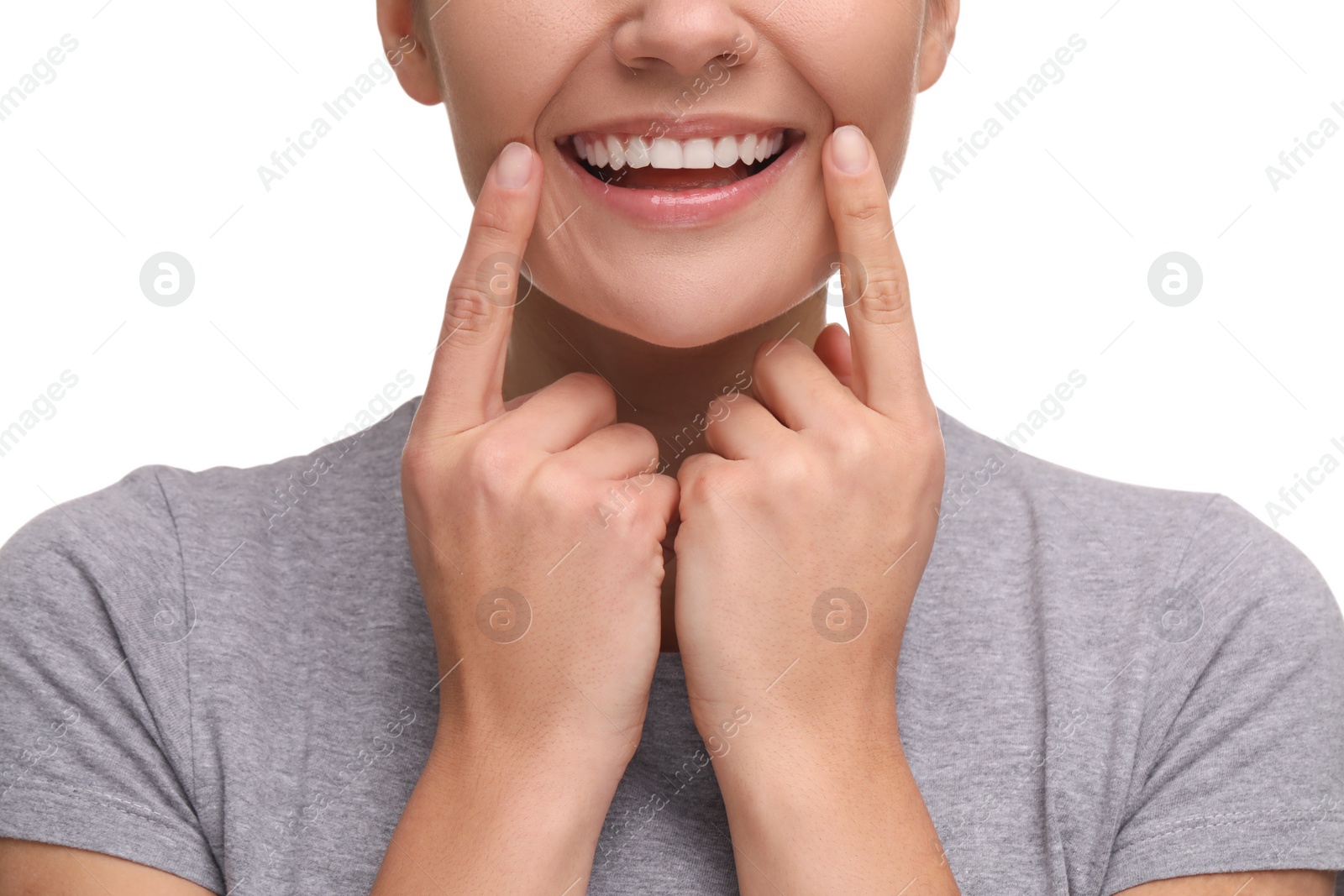 Photo of Woman showing her clean teeth and smiling on white background, closeup