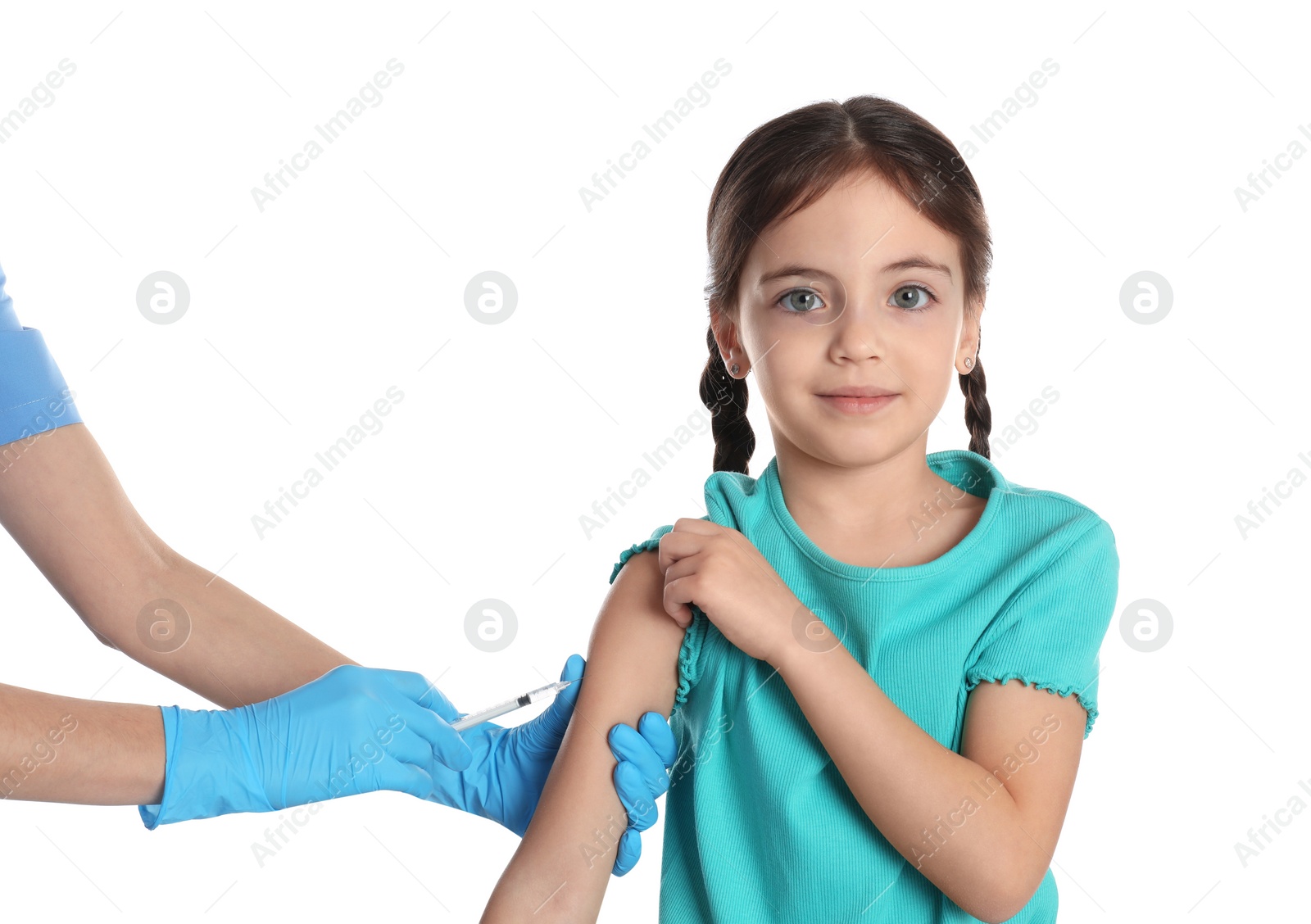 Photo of Doctor vaccinating little child on white background