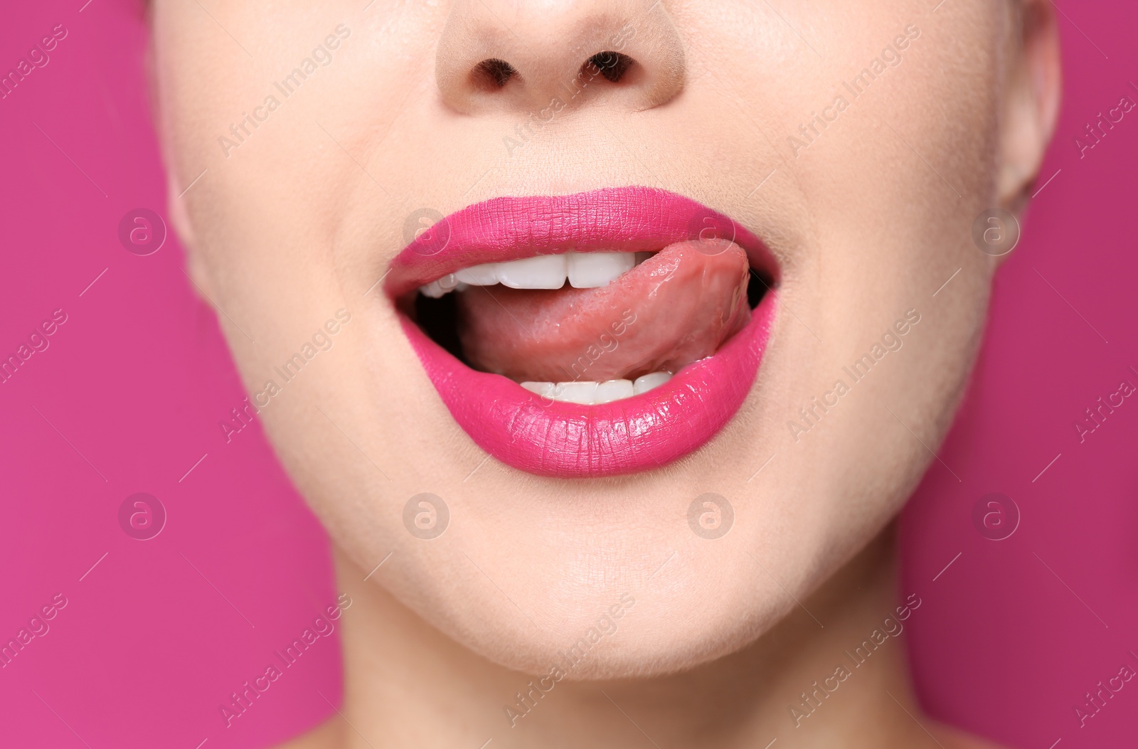 Photo of Beautiful young woman with perfect lips makeup on color background, closeup