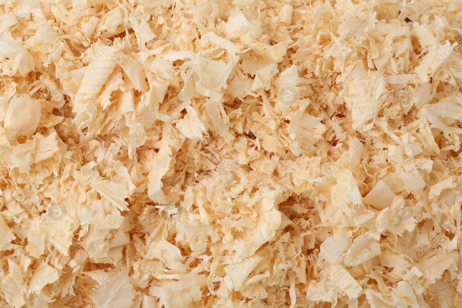 Photo of Pile of natural sawdust as background, top view