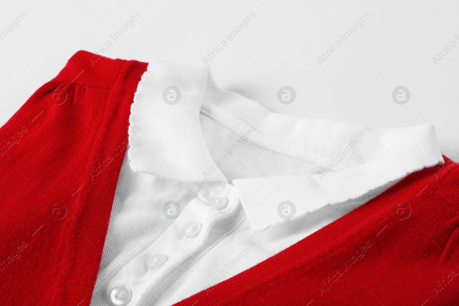 Photo of New stylish school uniform on white background, closeup