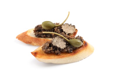 Photo of Tasty bruschettas with truffle paste and capers on white background