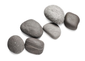 Photo of Group of different stones on white background, top view