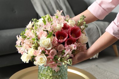 Woman with beautiful bouquet of fresh flowers indoors, closeup