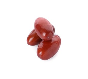 Three ripe red dates on white background