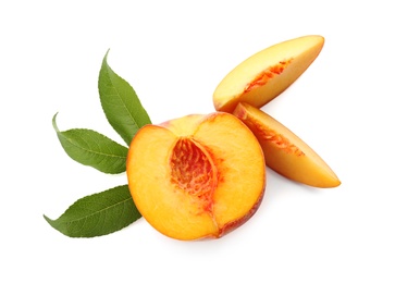 Photo of Cut fresh ripe peach with leaves on white background, top view