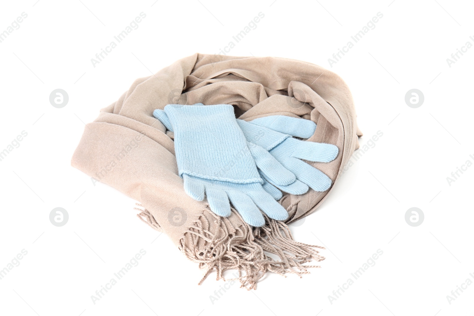 Photo of Stylish gloves and scarf on white background. Autumn clothes