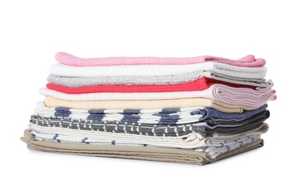 Stack of folded towels on white background