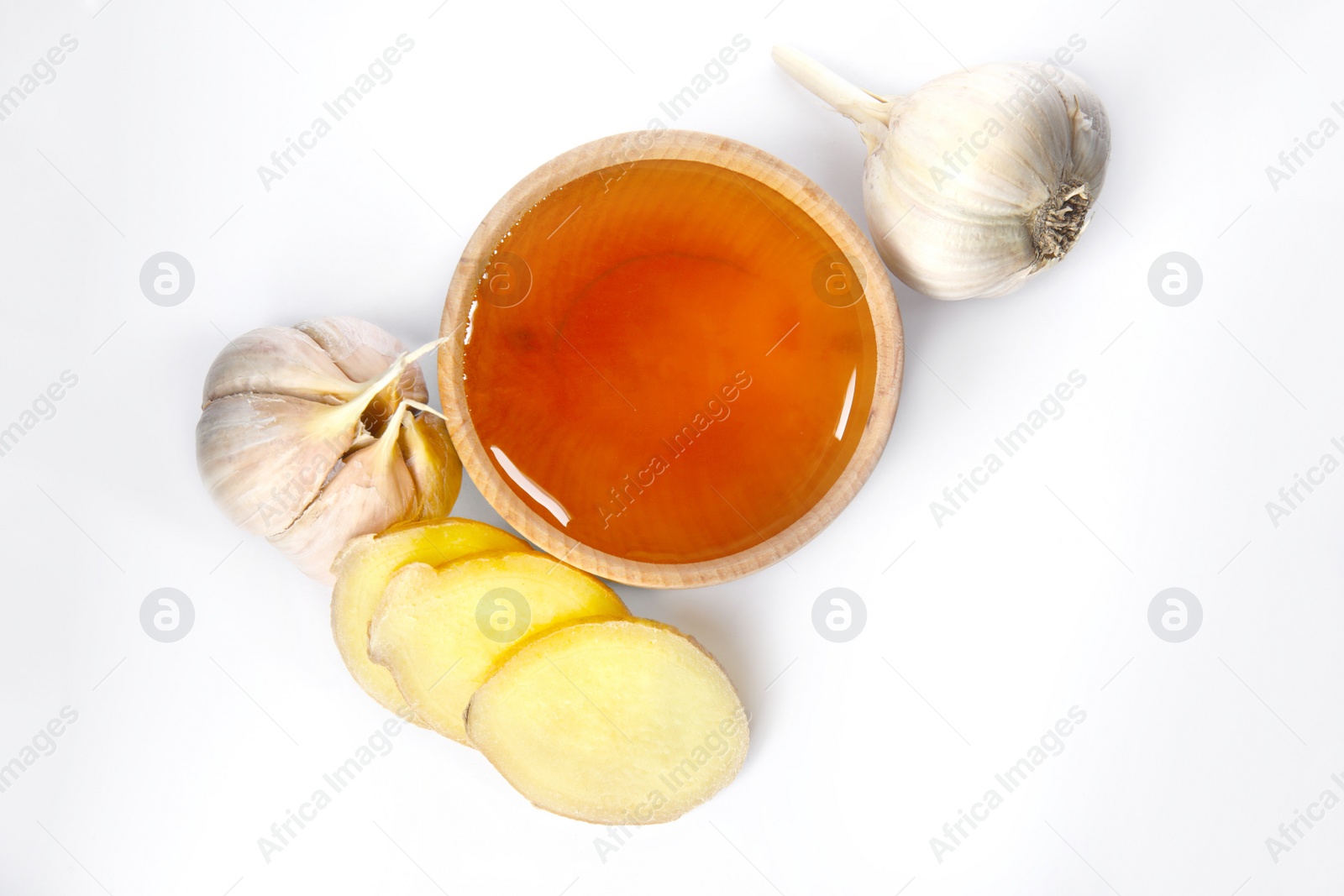 Photo of Fresh garlic and other natural cold remedies isolated on white, top view